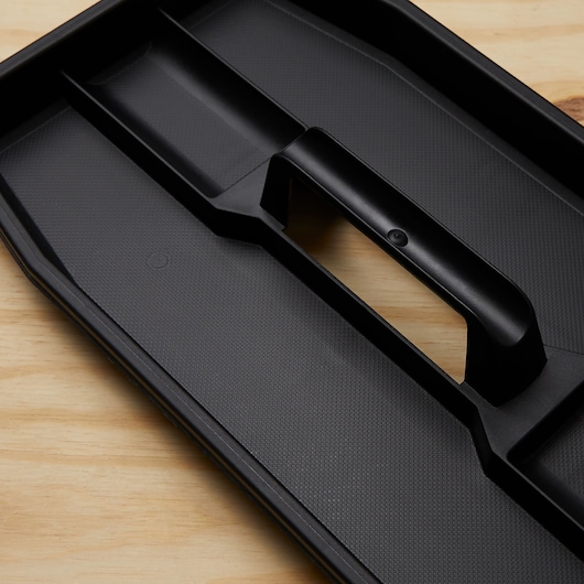 STANLEY SKU 020800R black plastic tool tray, angled view on wooden surface.