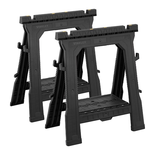 Photo of STANLEY 060864R black plastic sawhorse pair, side angle, with yellow details.