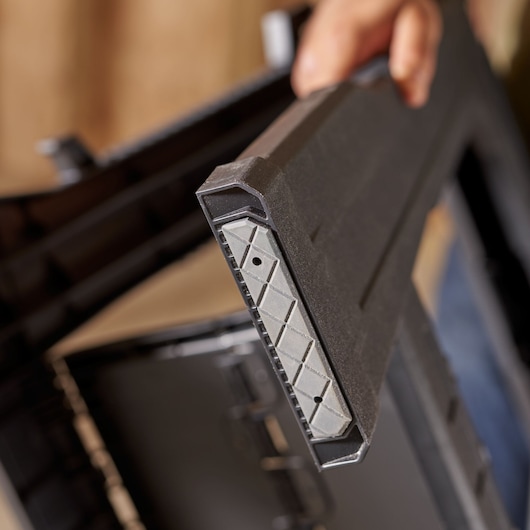 STANLEY 060864R tool box lid close-up showing textured black and gray plastic corner, photography angle.