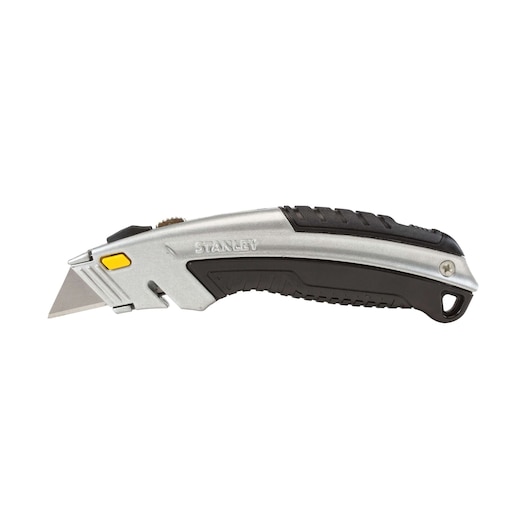 Stanley utility knife side view on white background, silver and black handle with yellow button and exposed blade
