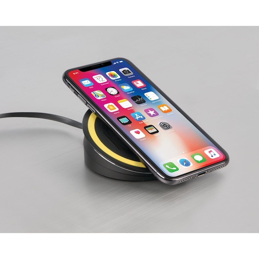 STANLEY 1310836ST2 wireless phone charger with black and yellow trim, side view on gray surface.