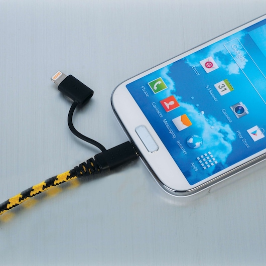 STANLEY 1319599ST2 yellow and black braided charging cable connected to smartphone, close-up angle.