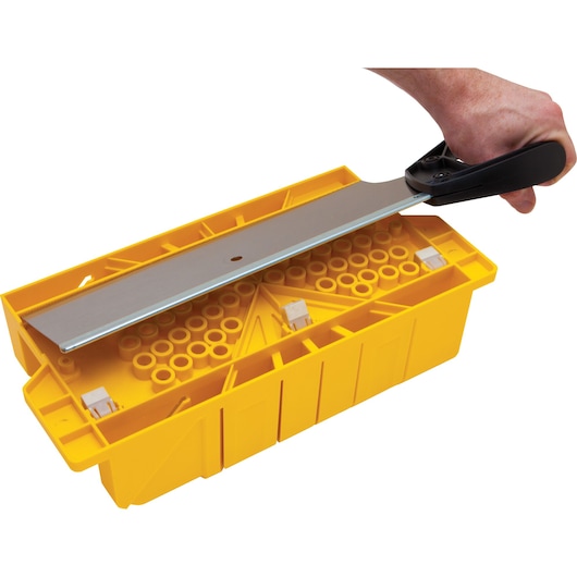 STANLEY 20-600 miter box set with yellow plastic box and hand saw, top view on white background.