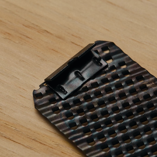 STANLEY 21-293 metal rasp blade with perforated holes, close-up, on wood surface.