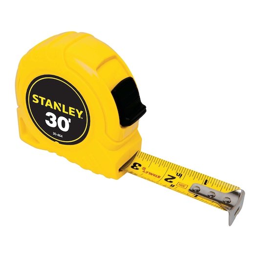 Stanley 30-foot yellow tape measure, side angle on white background with blade partially extended.