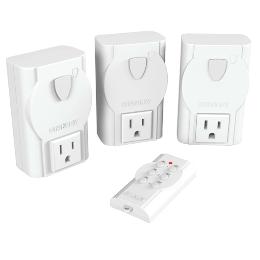 Front angle of STANLEY white remote control outlet kit with three plug-in sockets and handheld remote.