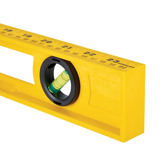 STANLEY 42-468 yellow spirit level with black circular vial and printed measuring scale, front angle on white.