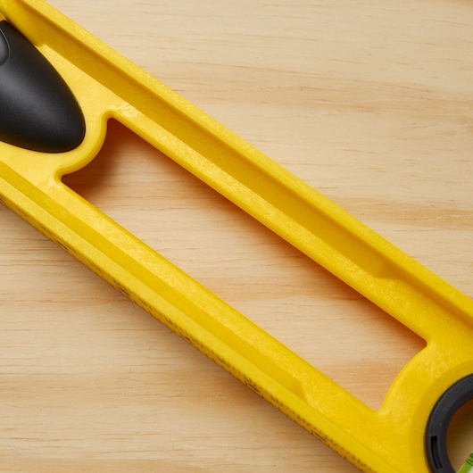 STANLEY 42-468 yellow level tool close-up, partial product on a wooden surface.