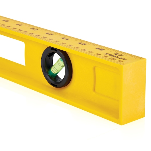 Photo of STANLEY 42-470 yellow spirit level ruler, close-up on measurement markings and bubble vial.