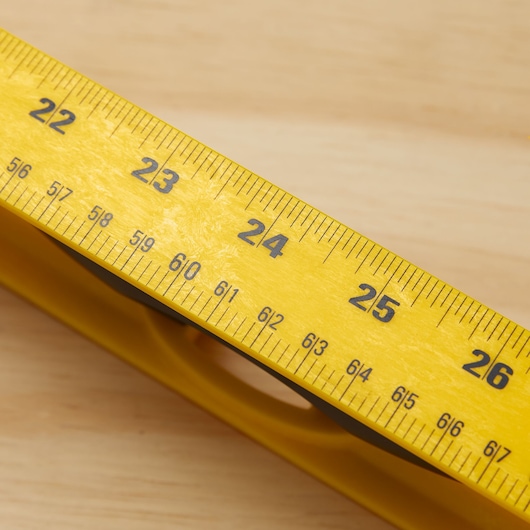 STANLEY 42-470 yellow measuring tape close-up showing inch and fraction markings.