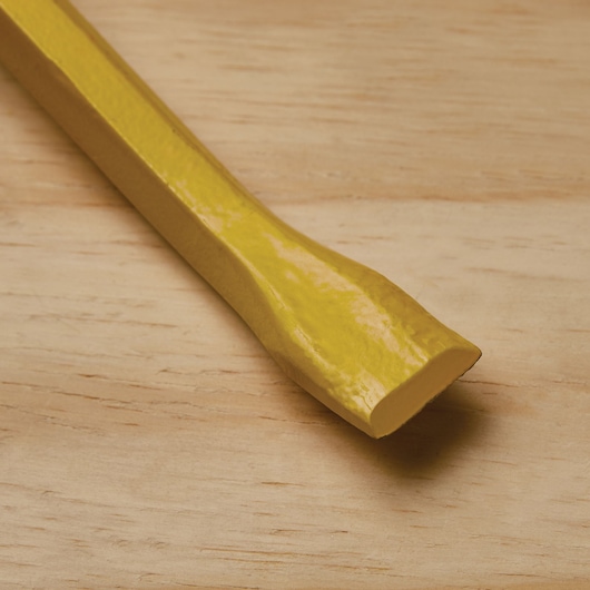 STANLEY 55-136 yellow pry bar photographed on a wood surface, close-up view of flattened end.