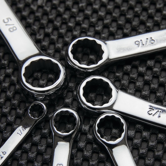 Stanley SKU 85-927 box-end wrenches photography, close-up of chrome tools on textured black surface.