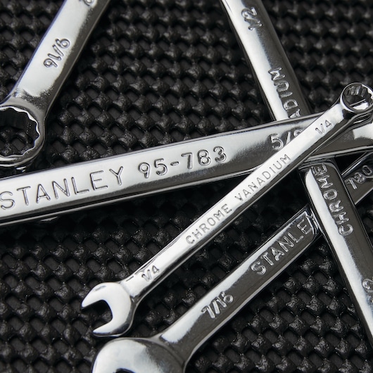 STANLEY 85-927 chrome vanadium wrenches grouped on textured black surface, close-up photo.