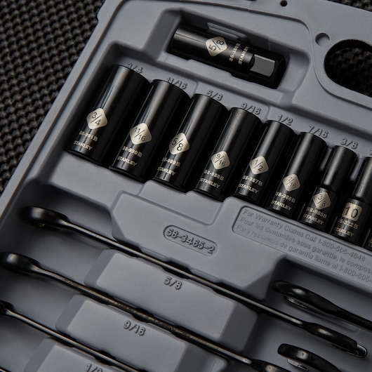 STANLEY socket set 92-839 with black finish, various socket sizes neatly arranged in a gray plastic case, top view.