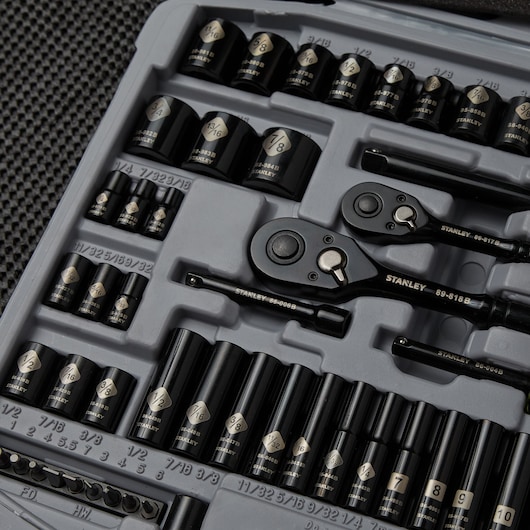 STANLEY 92-839 socket set with black sockets, ratchets, and extensions neatly organized in gray foam tray, top view.