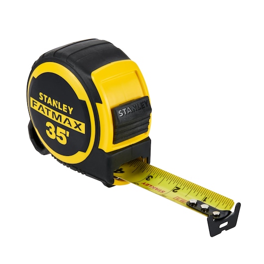 STANLEY FMHT36335THS tape measure, yellow and black, front angle, extended blade.