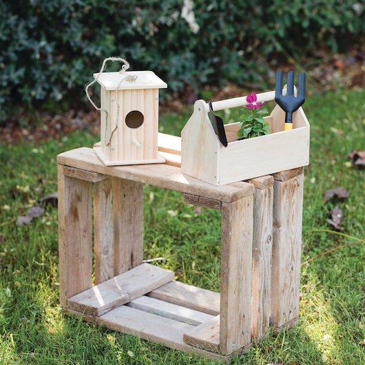 STANLEY K033-SY wooden birdhouse and planter box with garden tools on rustic crate outdoors.