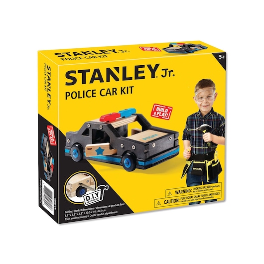 Stanley Jr. police car kit box, yellow packaging with toy police car and child wearing tool belt, front angle.
