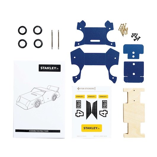 Stanley Jr. wooden car kit components top-down, including blue panels, wooden body, wheels, metal rods, screws, stickers, and instructions.