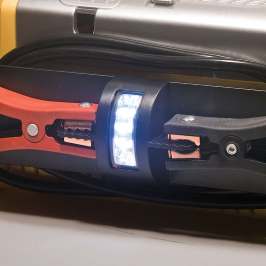 STANLEY PPRH5 jump starter close-up showing red and black clamps with LED work light.