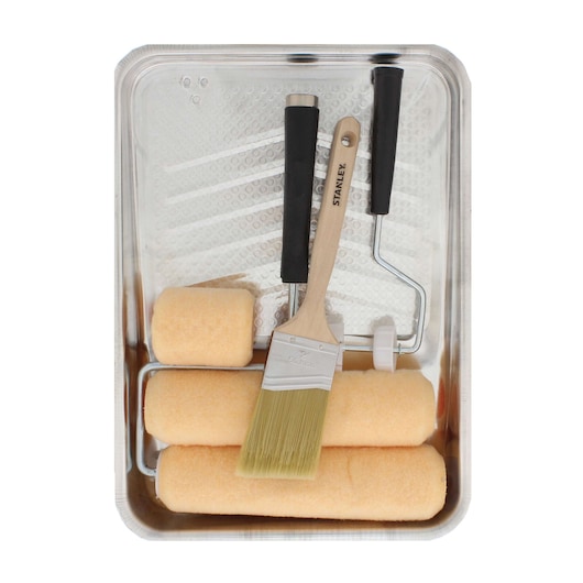 Stanley paint tray kit top view with paint roller frame, three roller covers, angled brush, and metal tray.