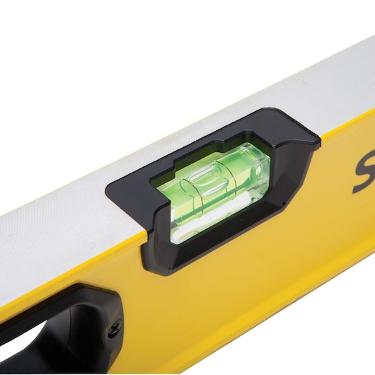 STANLEY STHT42496 level close-up, yellow and silver body, green bubble vial, top angle photo.
