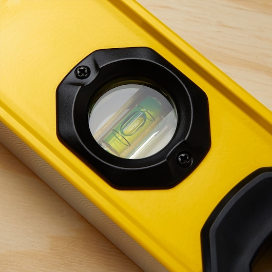 STANLEY STHT42504 level tool close-up showing yellow body and circular vial.