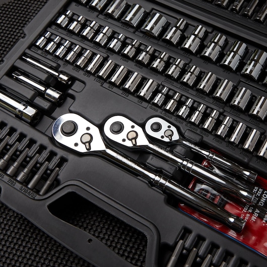 STANLEY STMT71654 socket set with ratchets and assorted chrome sockets in black plastic case, top angle.