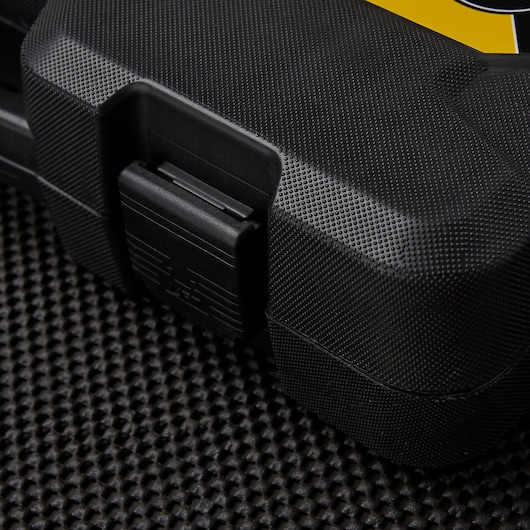 STANLEY STMT71654 hard black tool case with textured surface and secure latch, close-up angle.