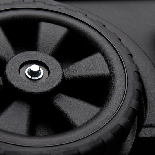STANLEY STST18613 photography of black plastic wheel with central metal hub, close-up angle.