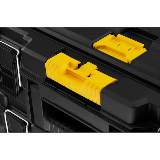 STANLEY STST60500 photography of black stackable toolbox with yellow latches, side angle view