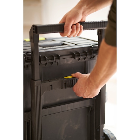 STANLEY STST60500 rolling tool box in black plastic, close-up showing handle and latch.